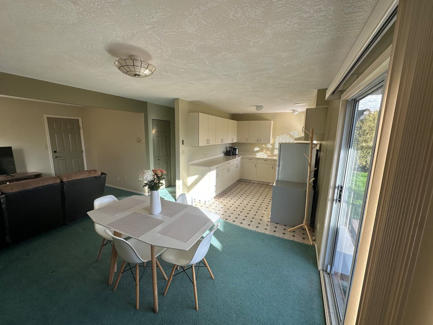 Open living and dining area leading to the kitchenette