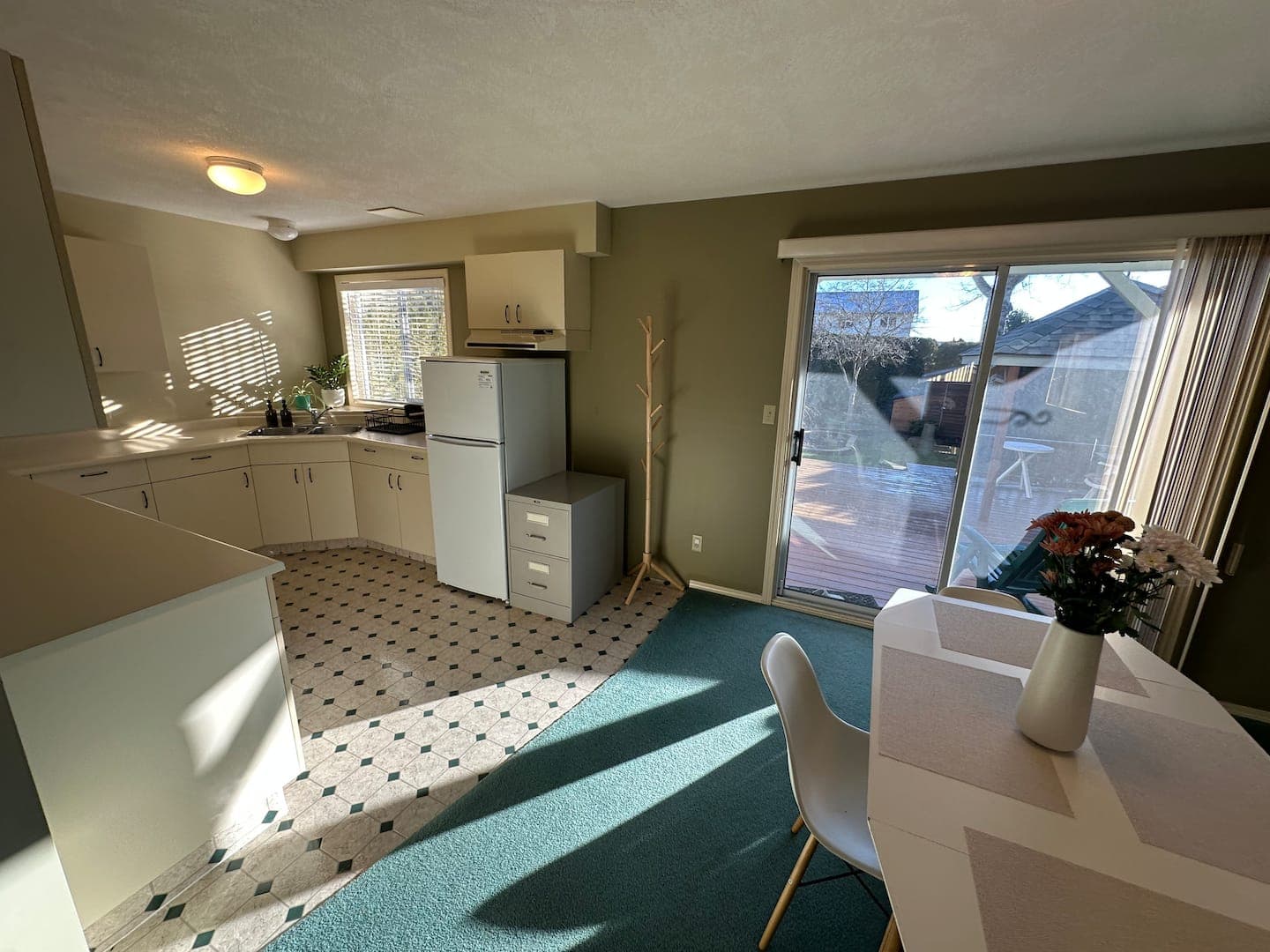 Kitchenette and sliding doors seen from the dining table
